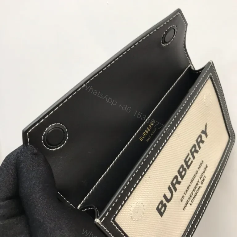 View 3 of Beige Canvas & Black Leather Crossbody: Bold Brand Duo