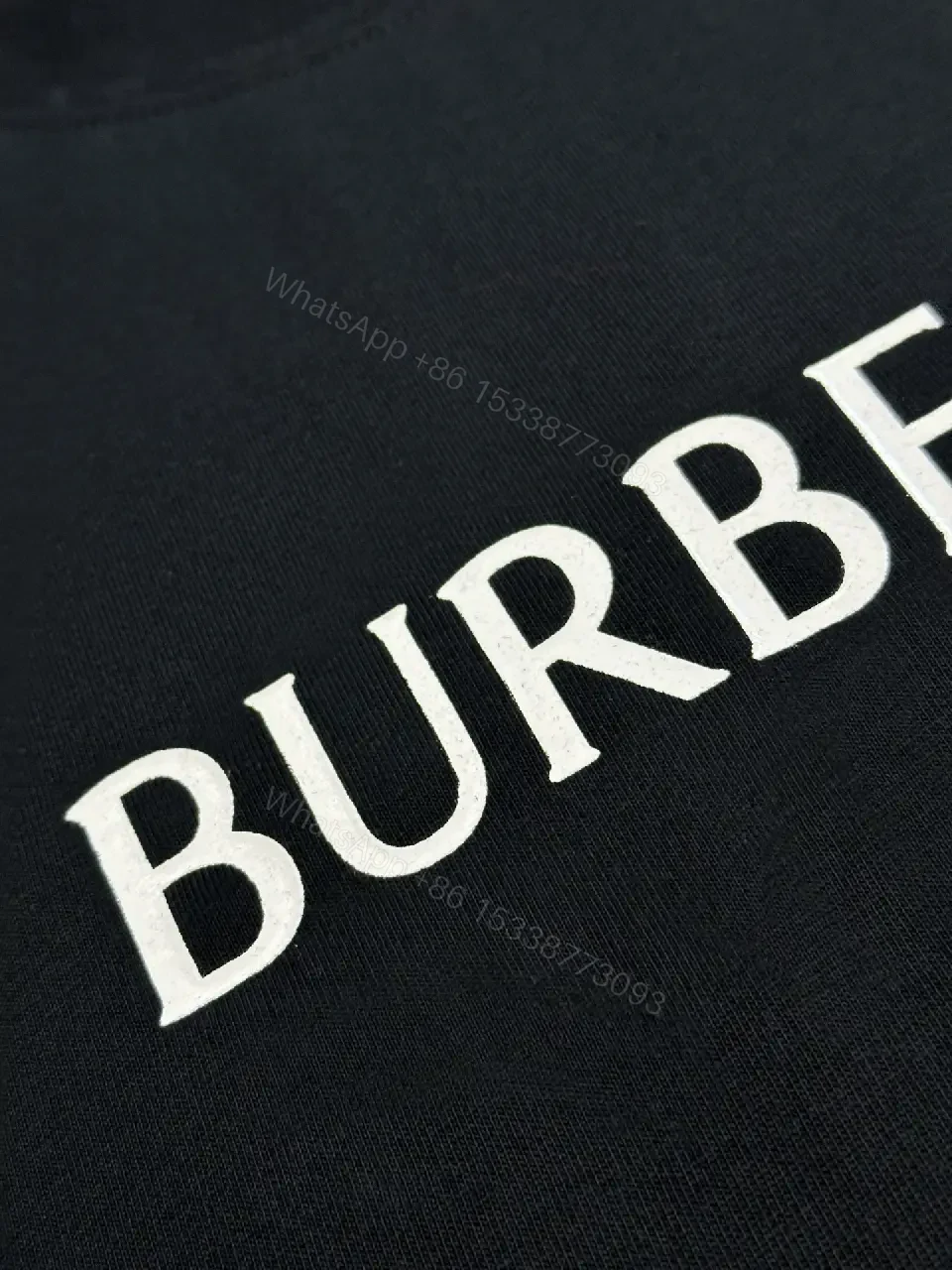 View 8 of Minimalist Black Cotton Tee | Relaxed Fit, Logo Accent, Everyday Luxury