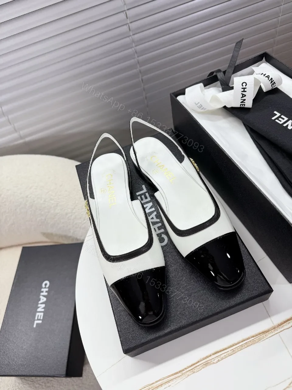 Two-Tone Patent Slingback Pumps: Sharp Architectural Elegance — view 1