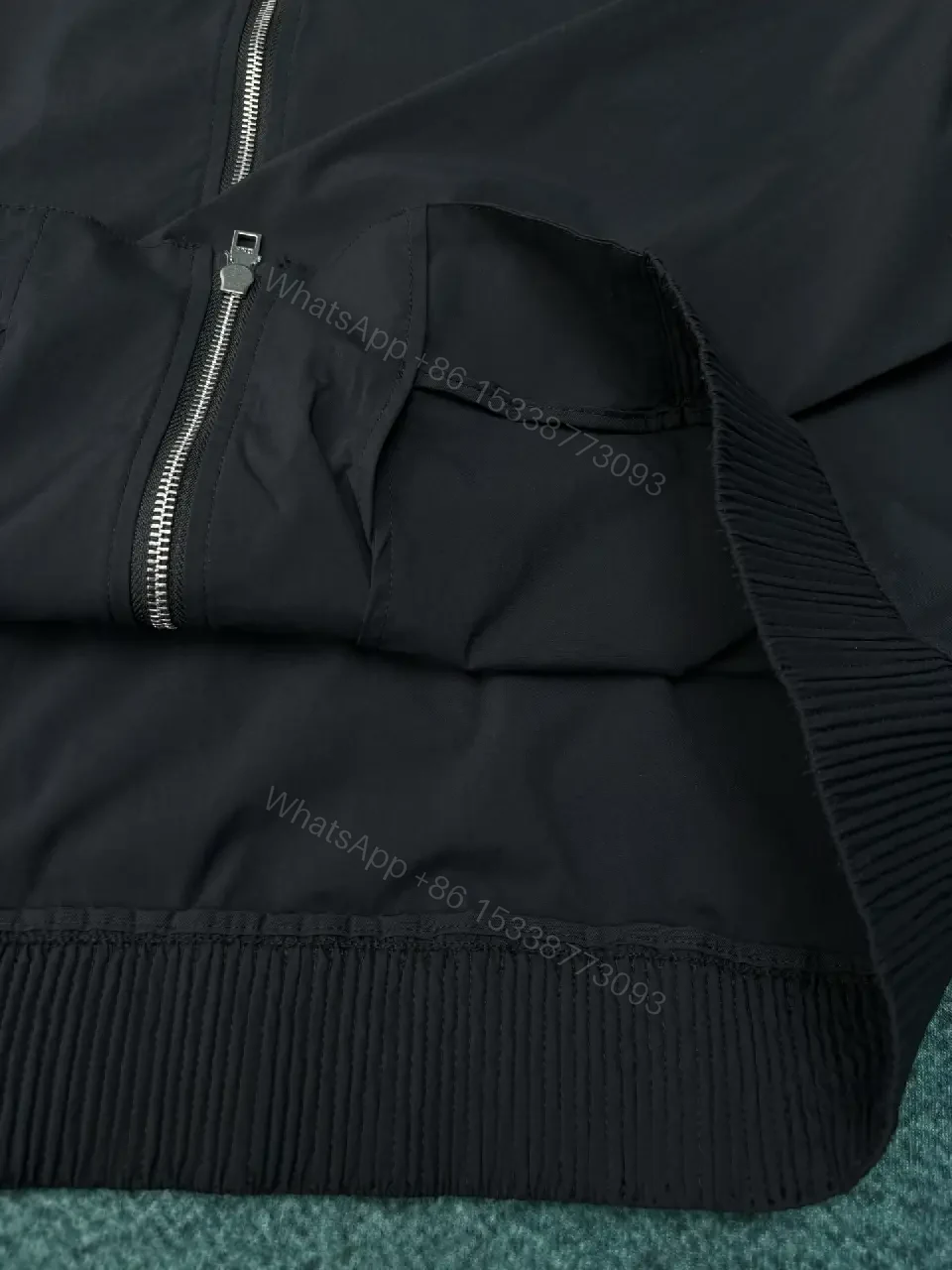 View 6 of Black Shell Bomber Jacket - Minimalist Luxury, Subtle Branding, Lightweight Warmth