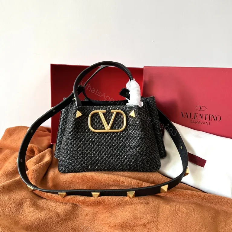 Black Woven Luxe Handbag: Compact, Gold-Accent Style Bag — view 1