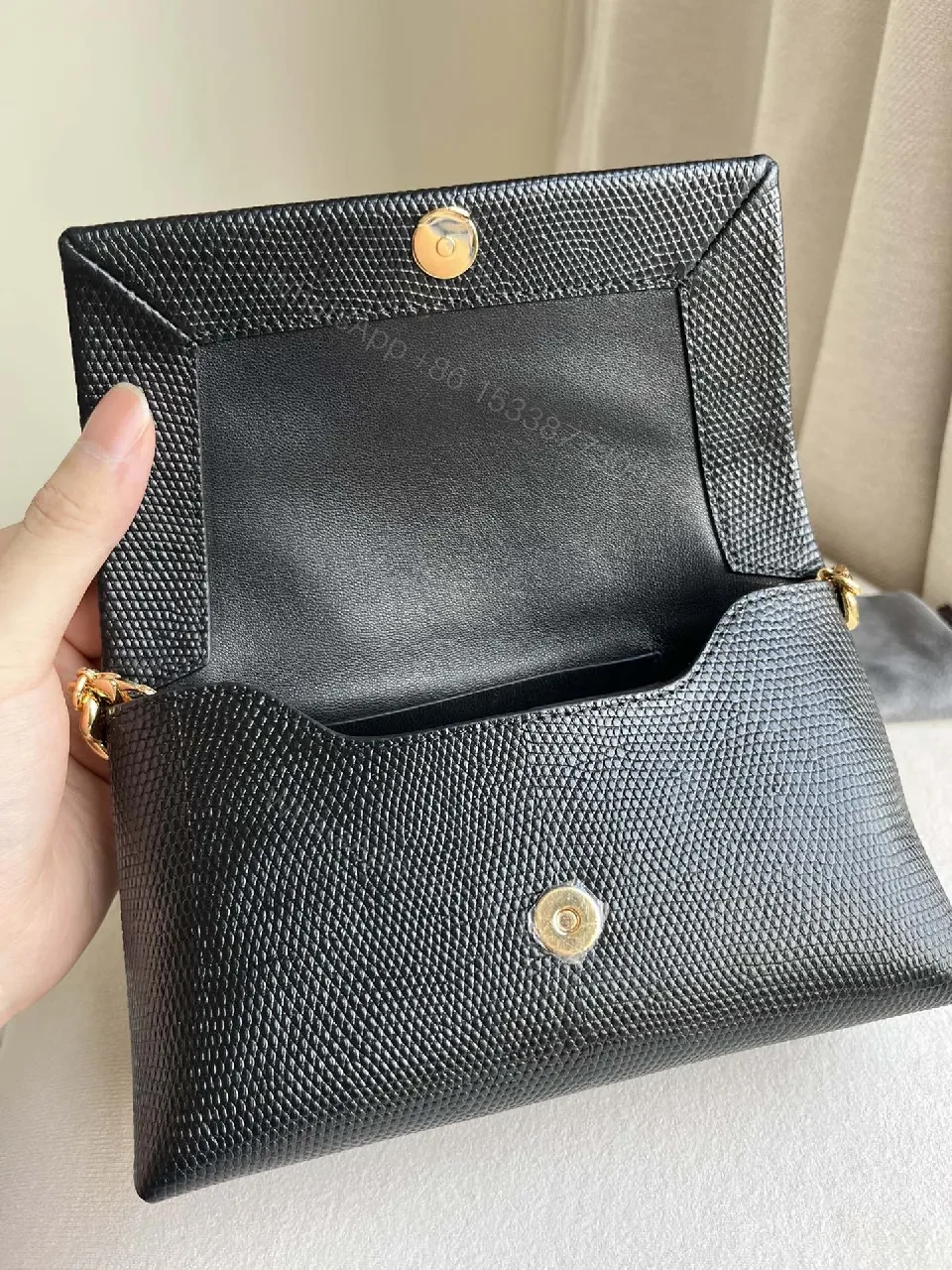 View 3 of Chic Black Leather Wallet with Gold Chain: Luxury, Compact