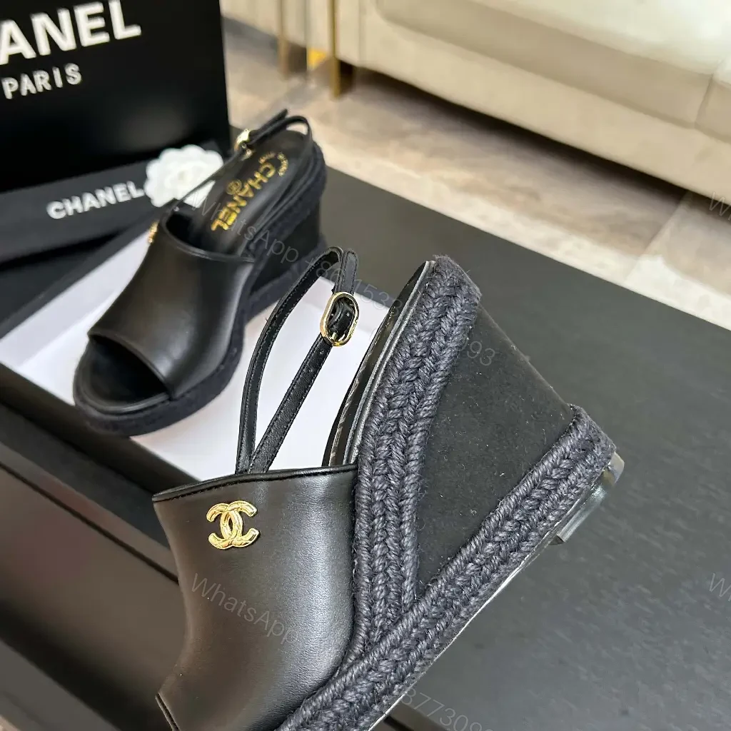 View 8 of Chic Black Leather Wedge Sandals - Gold Emblem, Open Toe, Slingback