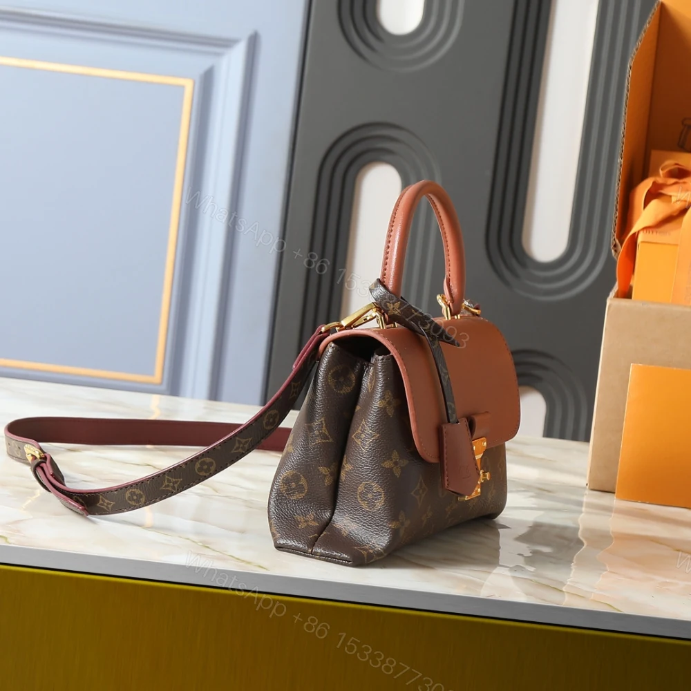 View 3 of Louis Vuitton Madeleine BB Monogram Cognac 24Cm M28288