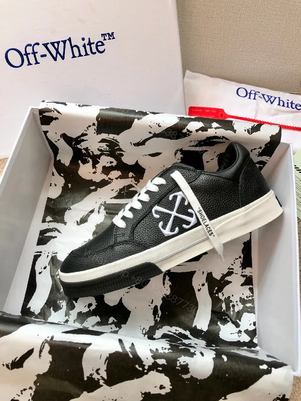 View 6 of Low-Top Black Pebbled Leather Sneakers with Signature Detailing