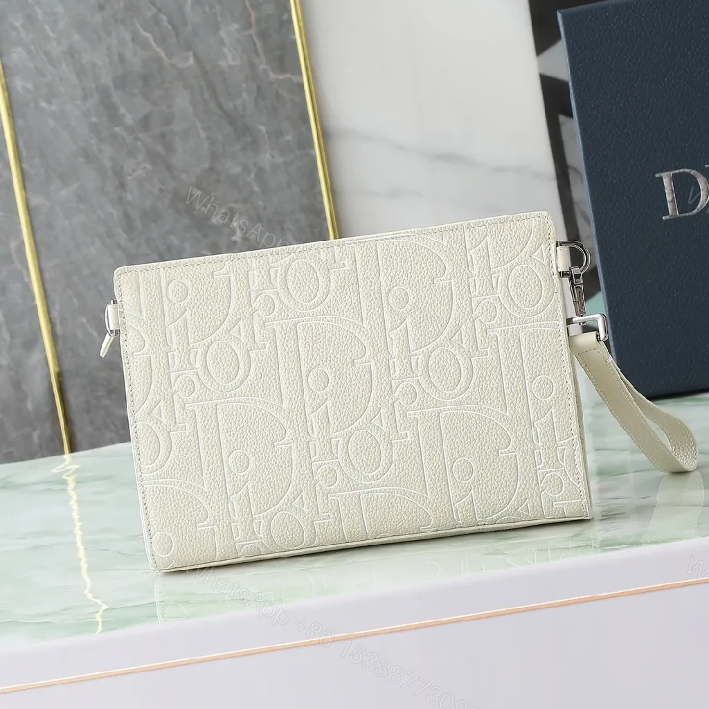 View 8 of Refined Monogram Clutch: Textured Grain, Silver Hardware, Lightweight Crossbody