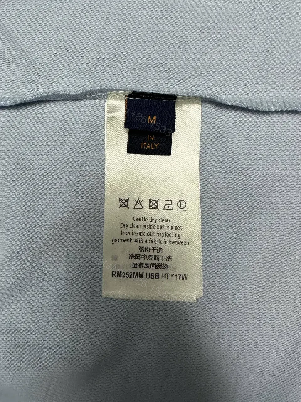 View 9 of Serene Gray Oversized Cotton Tee with Subtle Crest, Crewneck, Luxe Casual Top