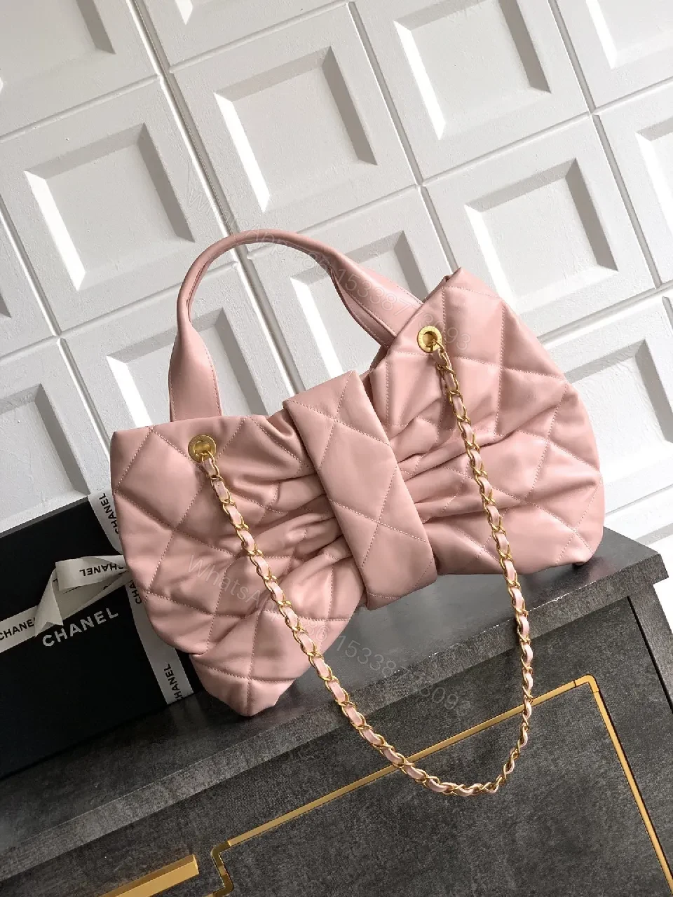 View 8 of Soft Pink Quilted Handbag with Gold Accents, Compact Luxury Tote