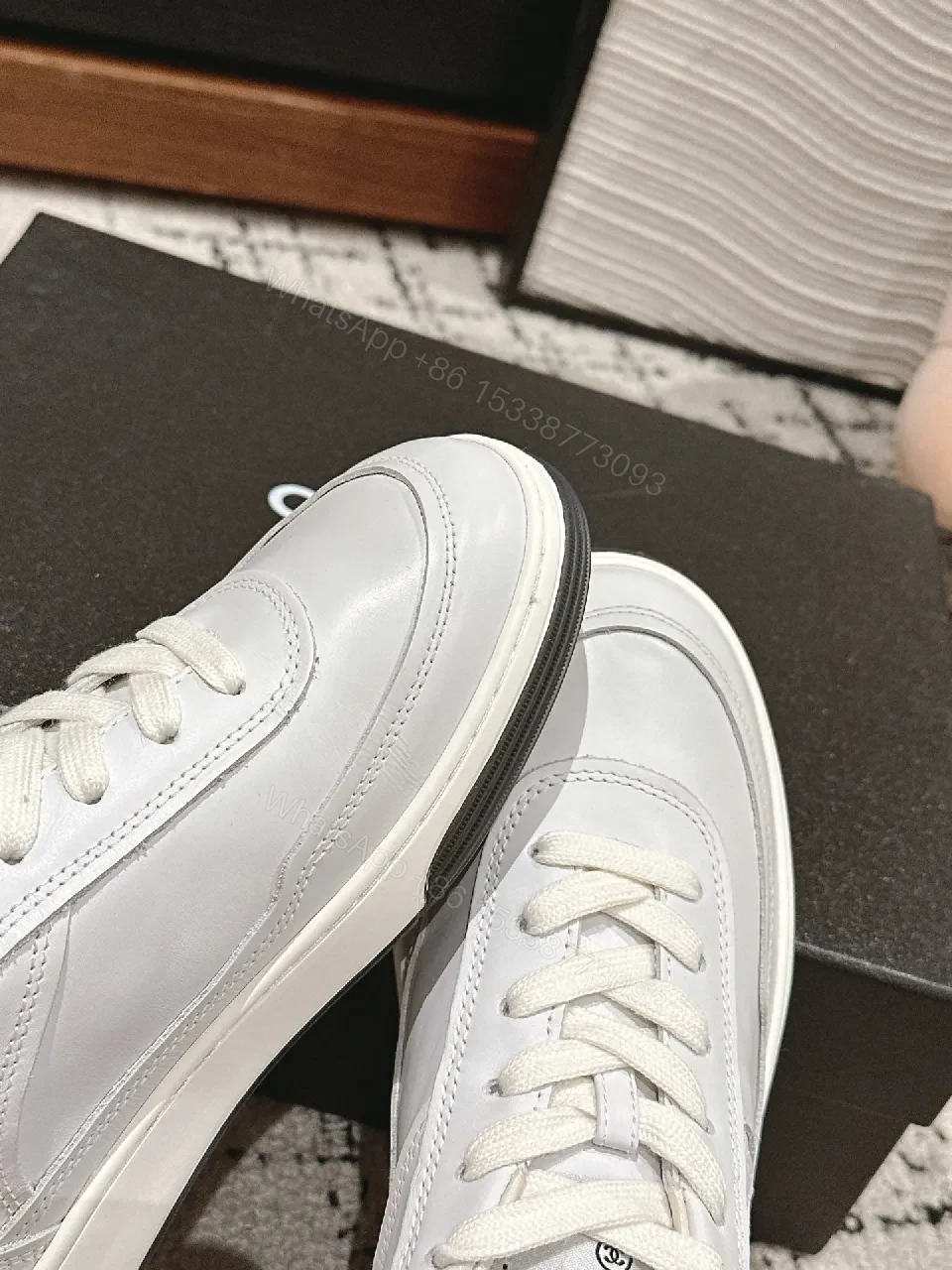 View 8 of Minimalist White Leather Sneakers with Subtle Chanel Detailing