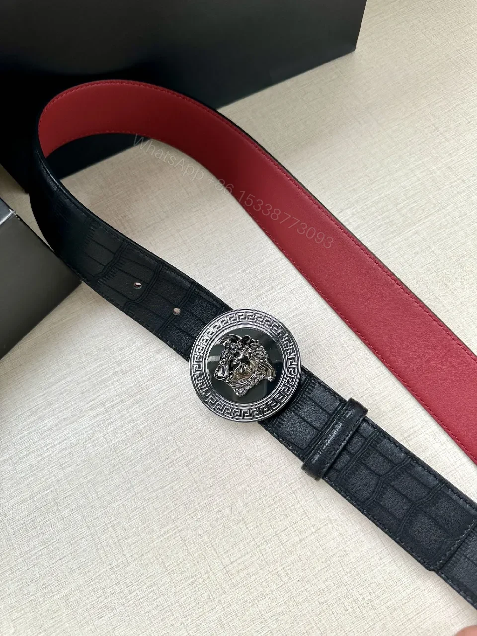 View 8 of Textured Leather Belt with Medusa Buckle - Crocodile-Embossed, Black/Burgundy, Luxury Belt