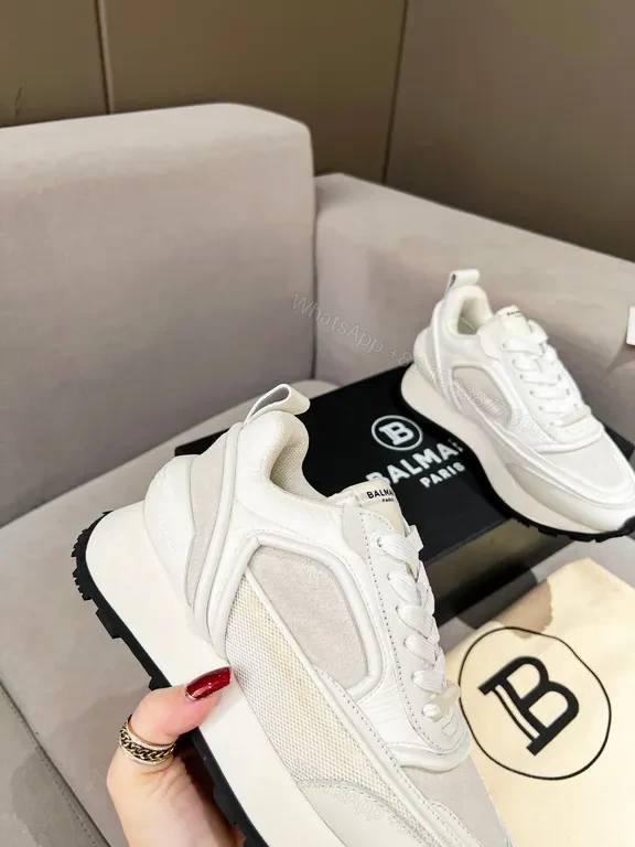 View 9 of Chic White Balmain High-Top Sneakers: Luxe Comfort