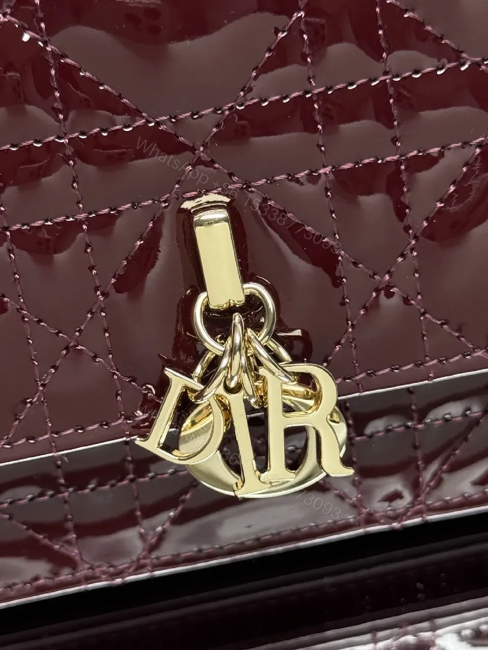 View 8 of Burgundy Patent Leather Clutch: Geometric Quilted Luxury