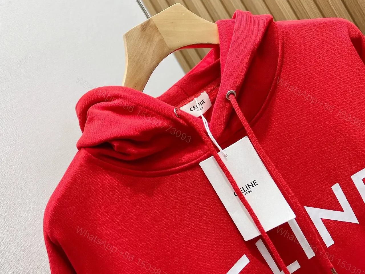 View 9 of Bold Red Hoodie with Celine-Inspired Typography