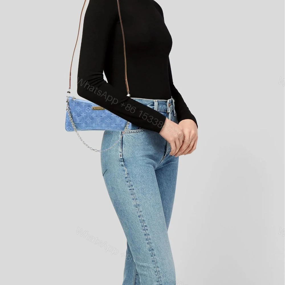 View 11 of Louis Vuitton Liv Pochette Blue Denim 25Cm M83532