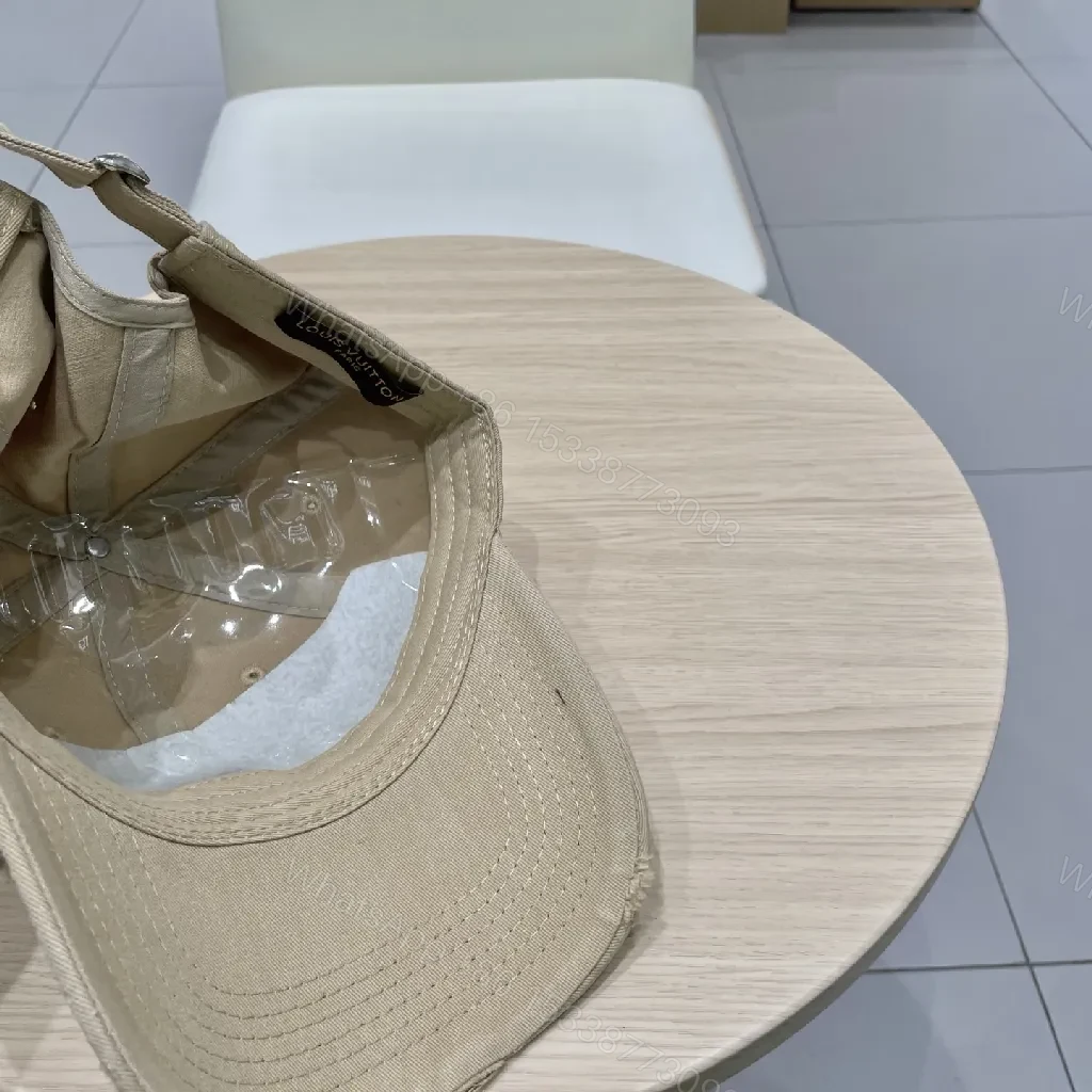 View 2 of Beige Cap with Textured Panels, Subtle LV-Inspired Emblem, Casual Luxury