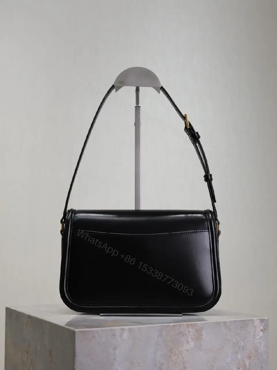 View 2 of Compact Black Leather Shoulder Bag with Gold Hardware