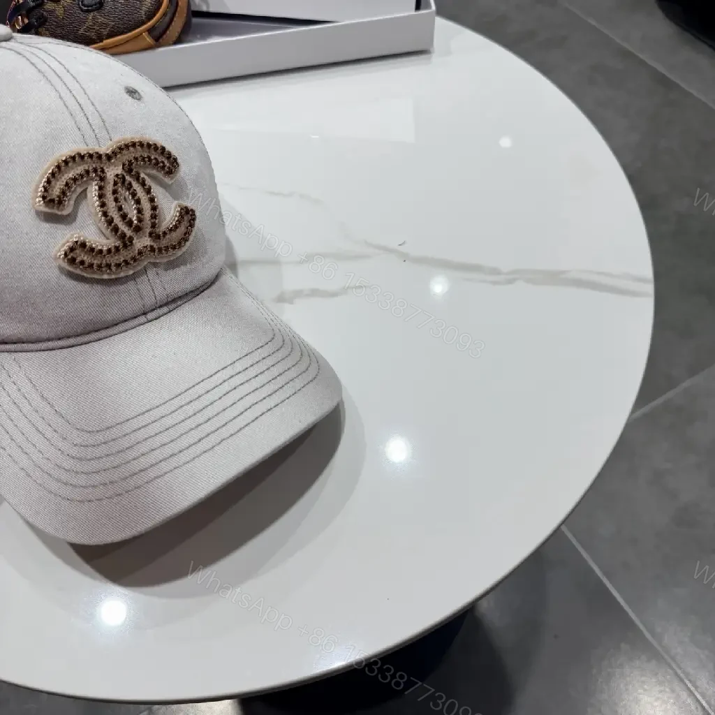 View 4 of Casual Luxe Cap: Subtle Denim, Interlock Emblem, Adjustable Strap