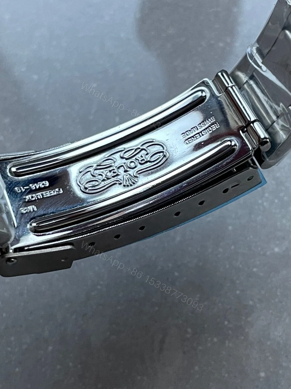 View 11 of VINTAGE Rolex Submariner Date Tiffany & Co 16610A30B9315 Black dial with SS bracelet