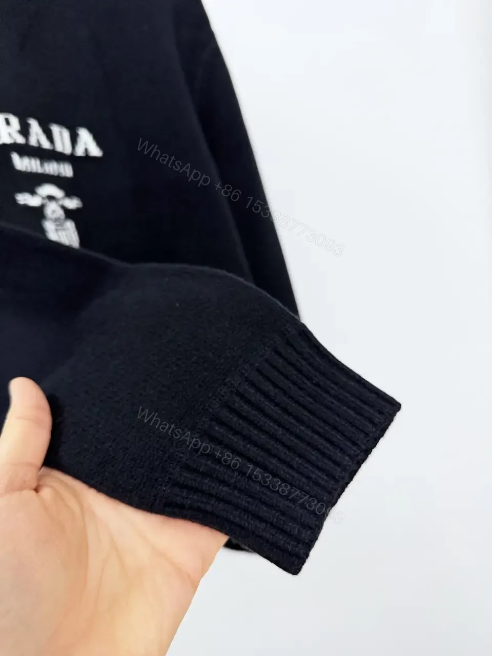 View 4 of Black Knit Pullover with Crest – Elevated Comfort Knitwear