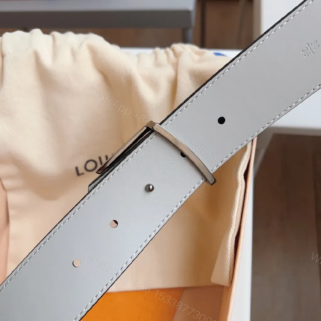 View 2 of Lux textured belt with signature metal buckle, premium leather