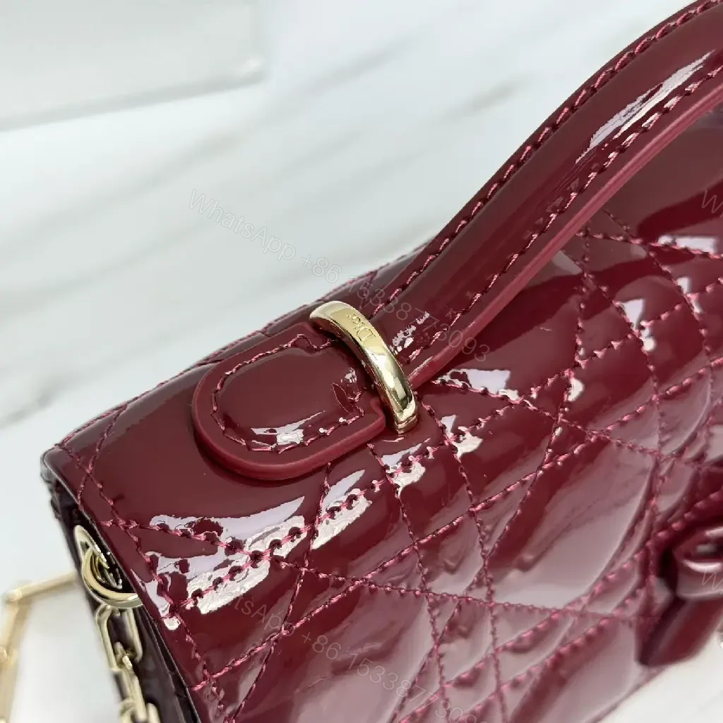 View 2 of Glossy Burgundy Quilted Mini Bag with Bow Accent