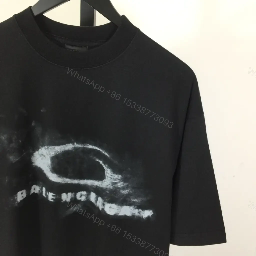 View 5 of Bold Graphic Tee with Distressed Logo: Luxe Streetwear Tee