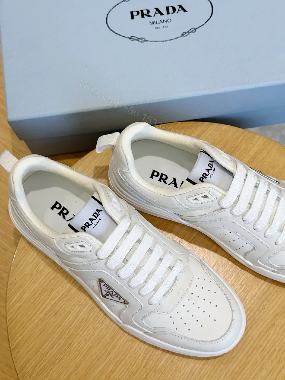 View 5 of White Leather Sneakers Minimalist Cushioning Prada Style Sneakers