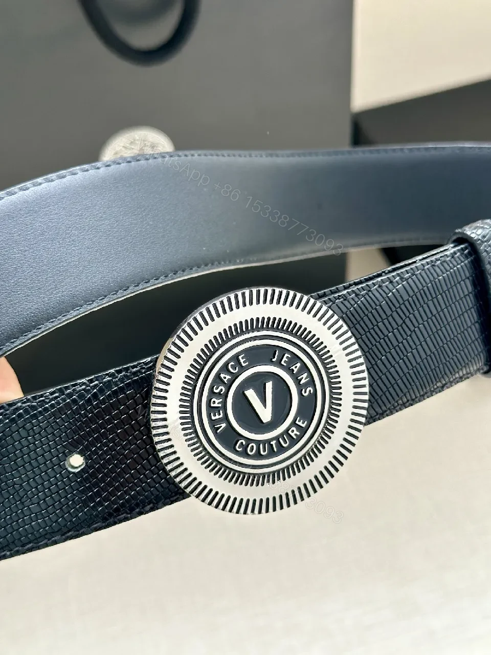 View 5 of Textured Leather Belt with Round Emblem Buckle – Luxe Minimalist Style