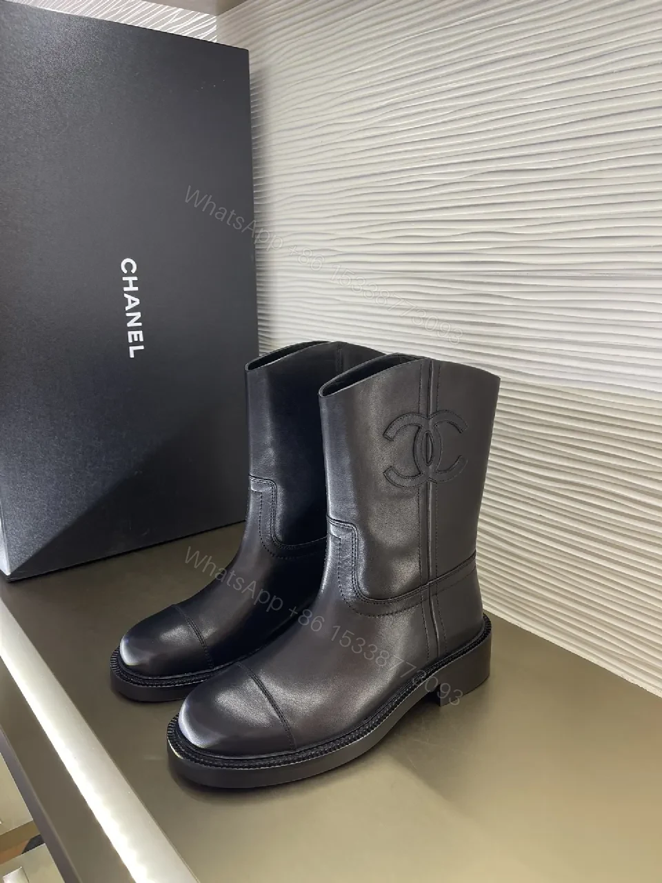 Chic Black Leather Knee-High Boots with Logo Embellishment — view 1