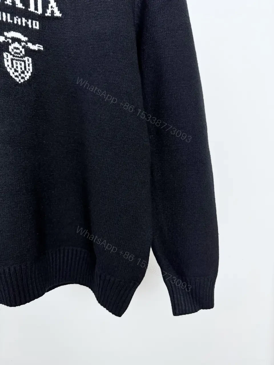 View 6 of Black Knit Pullover with Crest – Elevated Comfort Knitwear