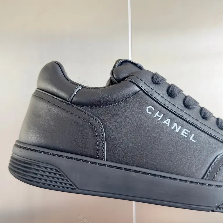View 9 of Chanel-Inspired Black Leather Sneakers: Discreet Luxury Comfort