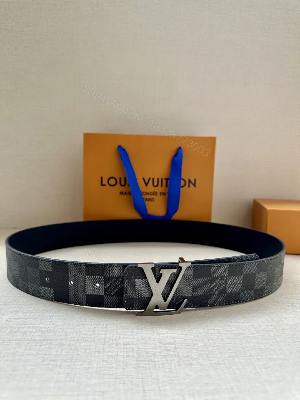 View 4 of Checkerboard Canvas Belt with Signature Buckle – Premium Modern Accessory