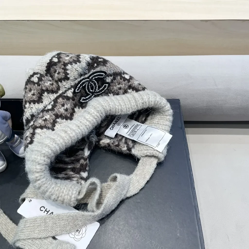 View 3 of Marled Knit Hat with Logo & Ear Flap Detail – Cozy Luxe