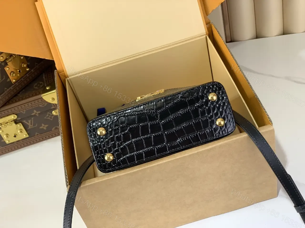 View 9 of Chic Black Crocodile-Embossed Mini Handbag with Gold Hardware