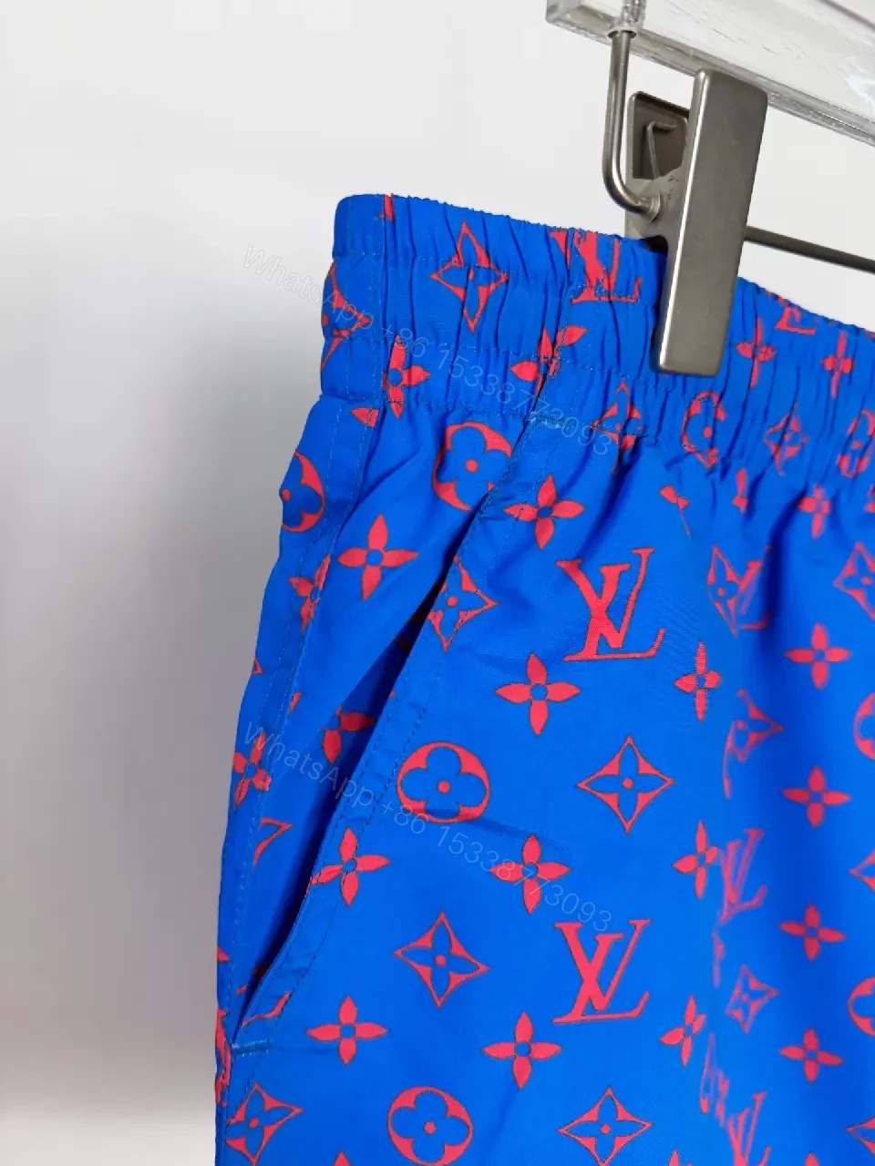 View 2 of Blue Louis Vuitton Monogram Swim Shorts with Red Drawstring