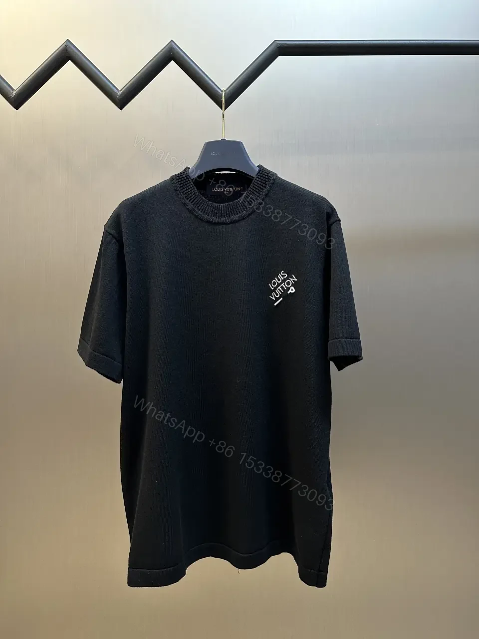 View 2 of Minimalist Black Crewneck Tee Dress – Subtle Logo, Versatile Dress