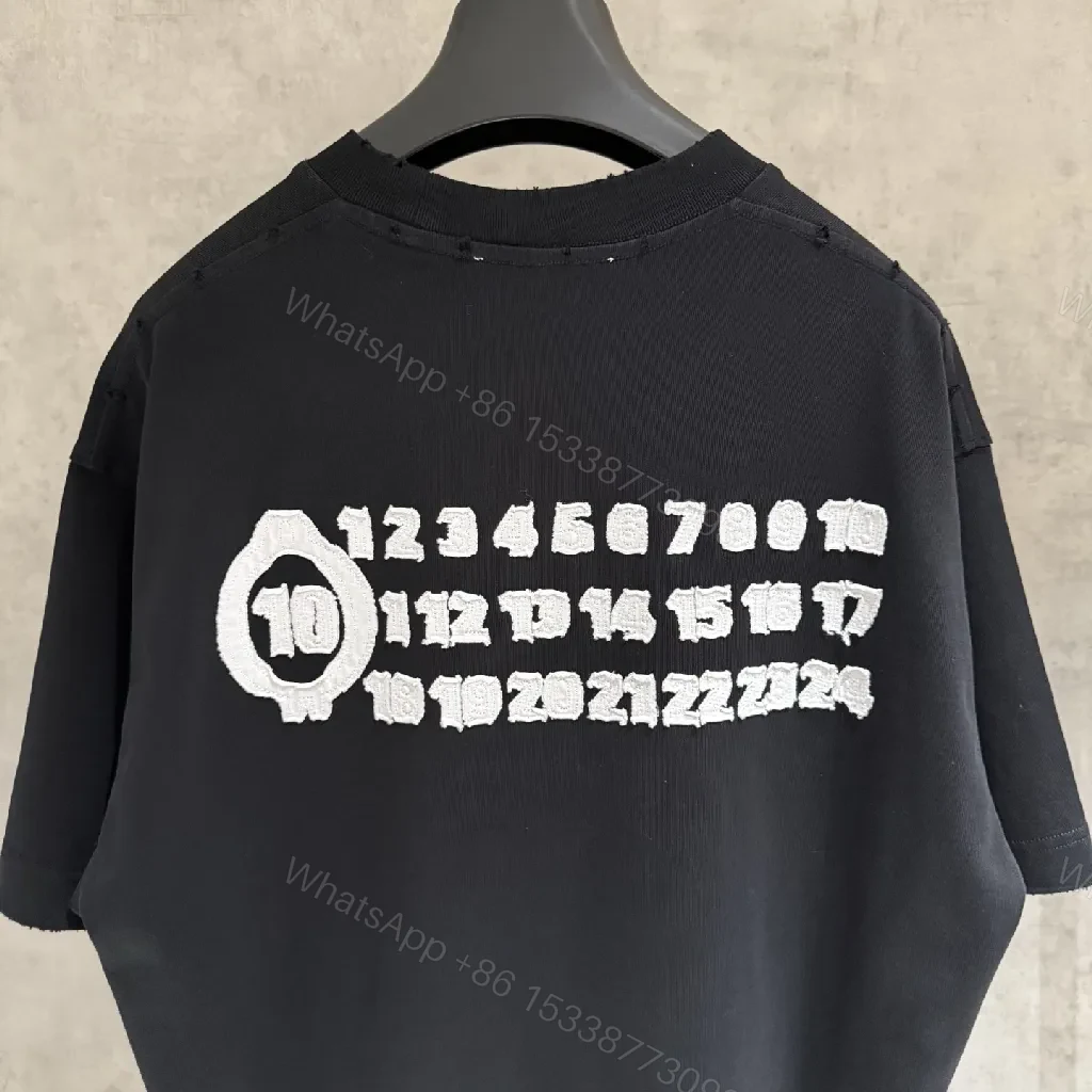 View 8 of Oversized Black Tee with Subtle Dot Logo — Luxe Everyday Wear