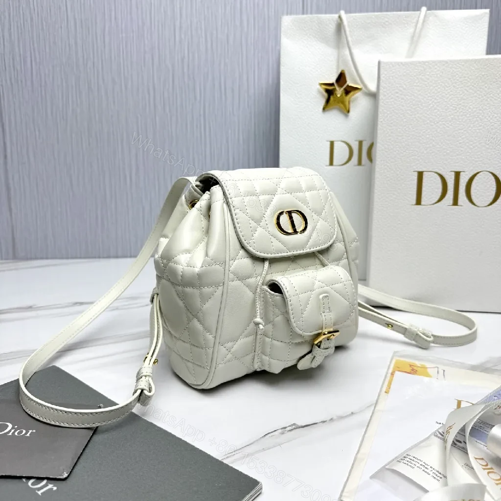 View 4 of Quilted White Mini Backpack with Gold Hardware - Compact Luxury