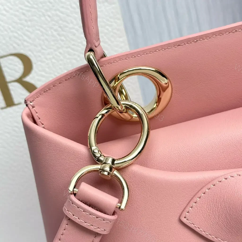 View 9 of Soft Pink Faux-Leather Satchel: Bow Accent, Sculpted Diagonal Panels, Crossbody Comfort
