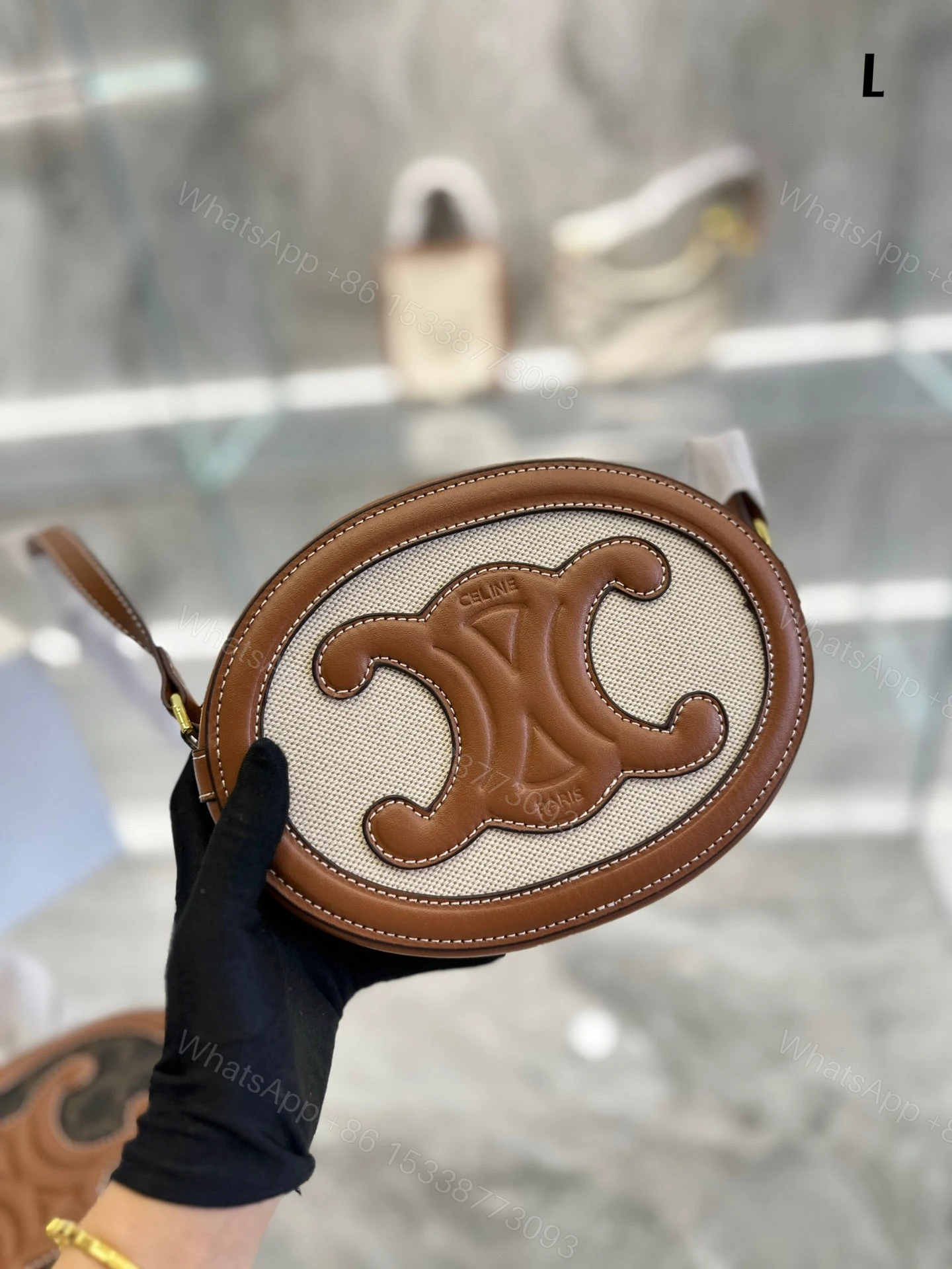 View 2 of CELINE OVAL BAG CUIR TRIOMPHE IN TEXTILE AND CALFSKIN NATURAL 20CM 198602EFL02NT