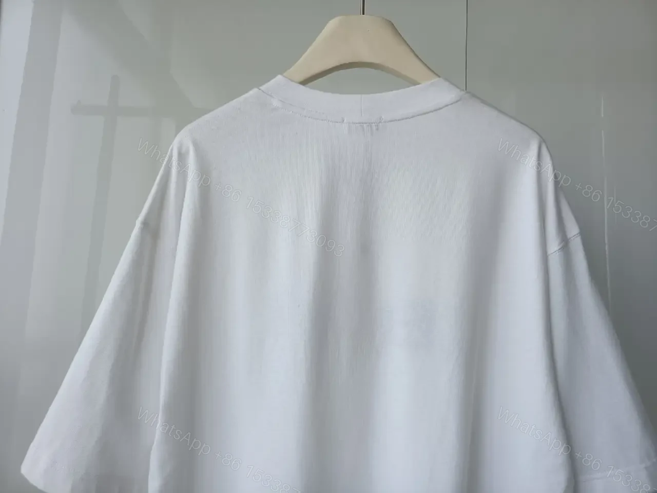 View 6 of Minimalist White Cotton Tee - Relaxed Luxe Comfort