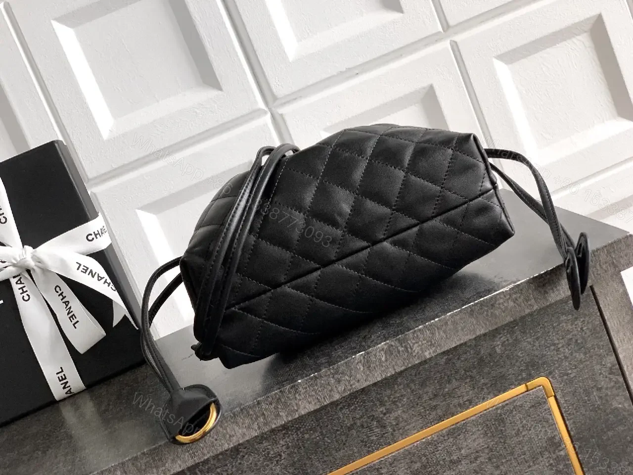 View 4 of Quilted Drawstring Bag - Black Leather-Feel, Gold Accent