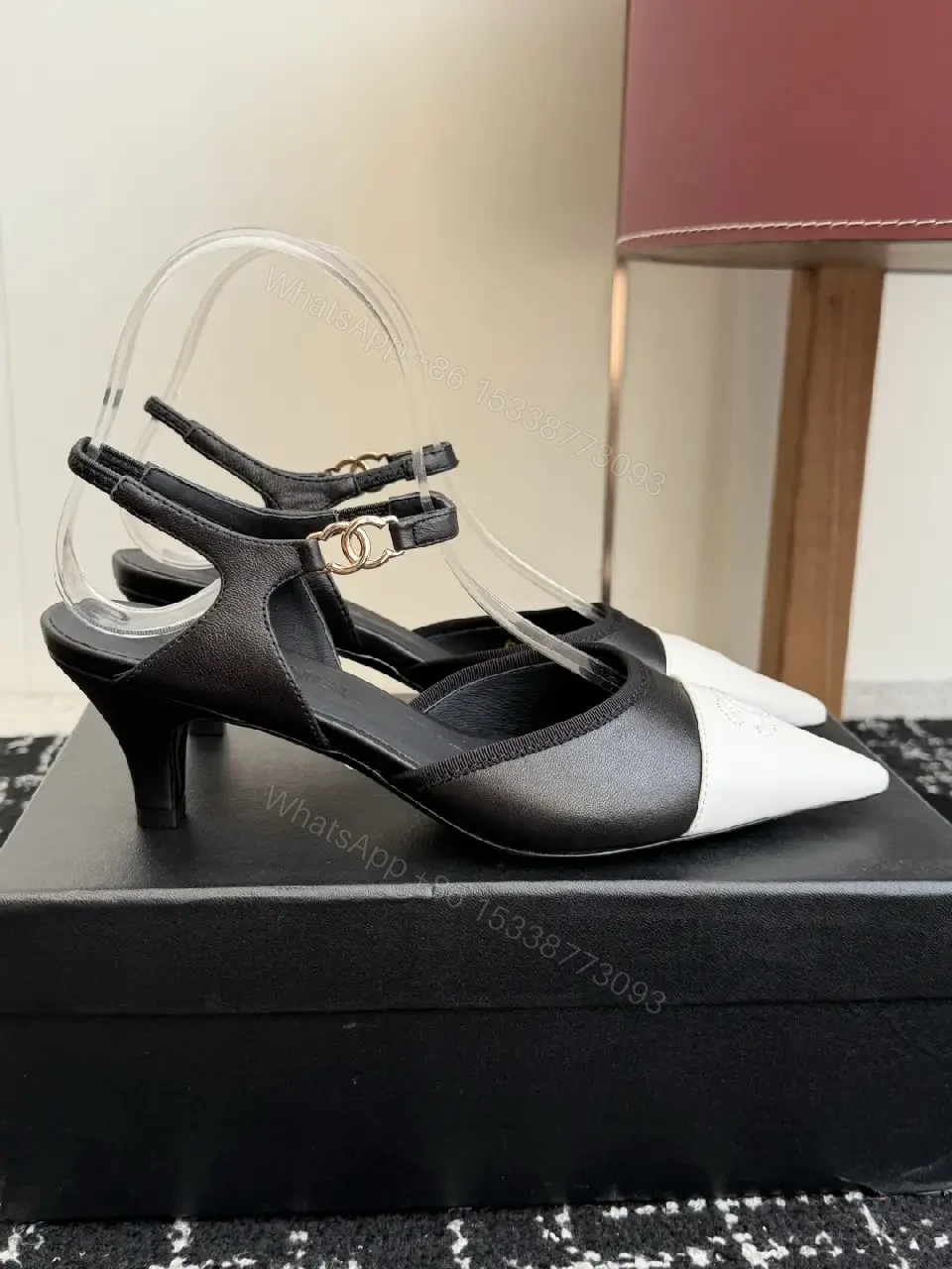 View 4 of Black White Leather Slingback Heels with Chanel Logo, Pointed Toe, 2-inch Heel