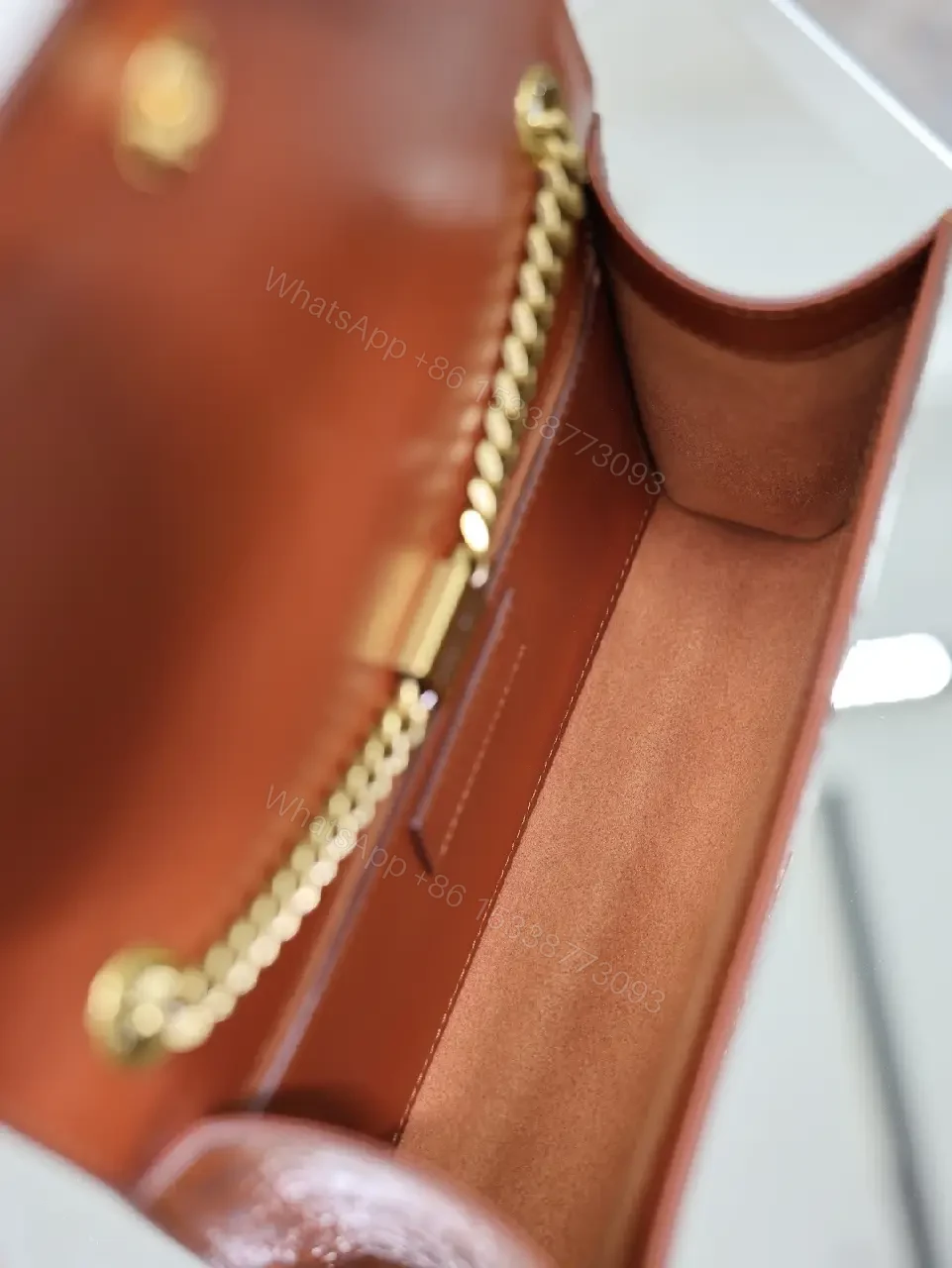 View 10 of Brown Crocodile-Embossed Leather Clutch with Gold Logo Clasp