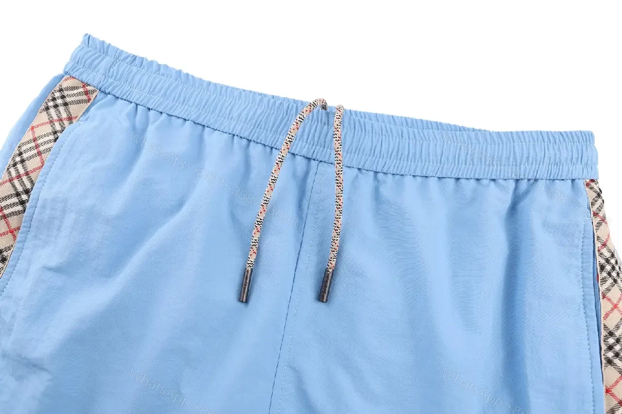 View 6 of Light Blue Cotton-Blend Swim Shorts with Burberry-Check Side Strips