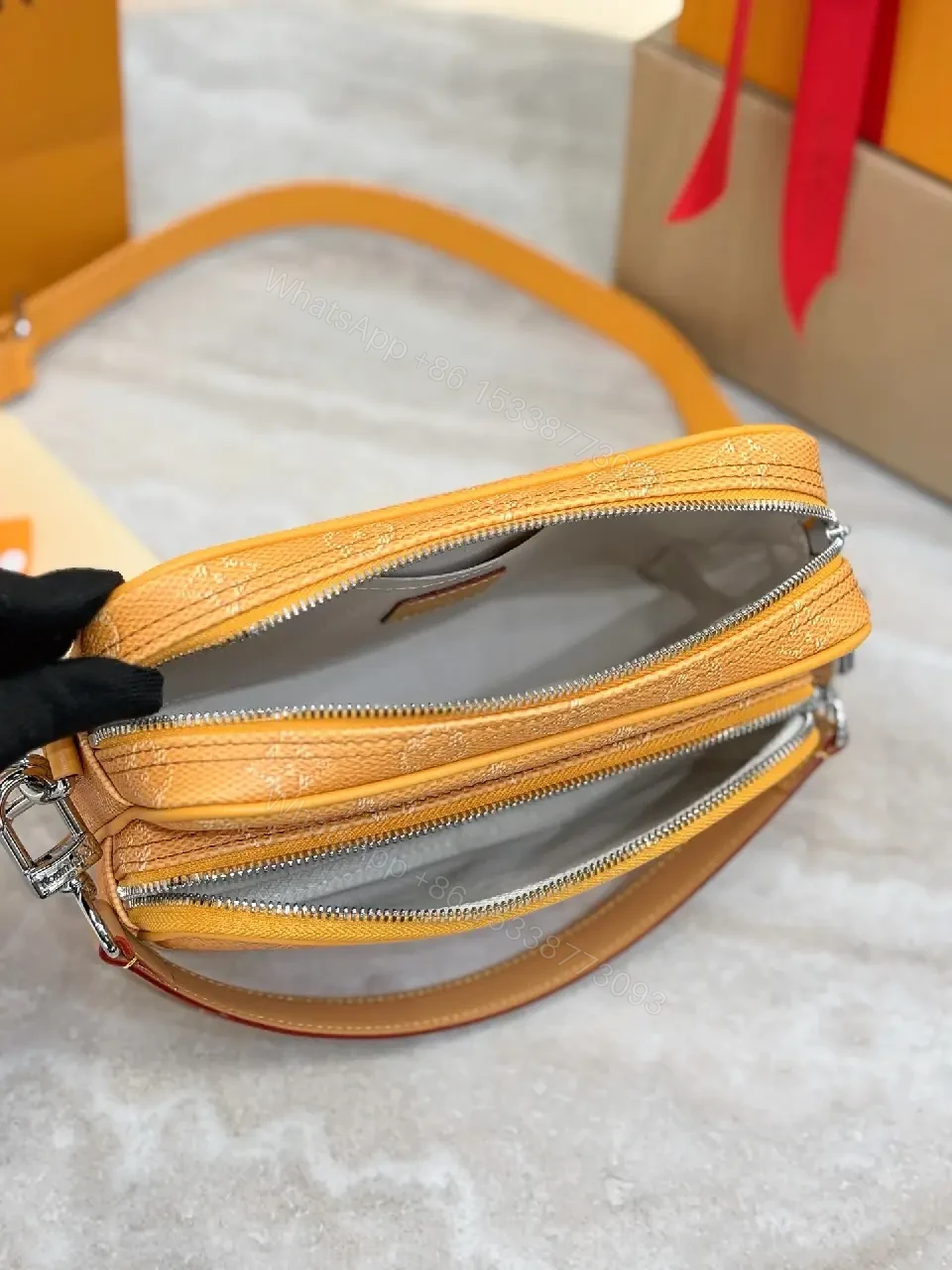 View 6 of Caramel Canvas Crossbody: Textured Monogram, Compact Chic