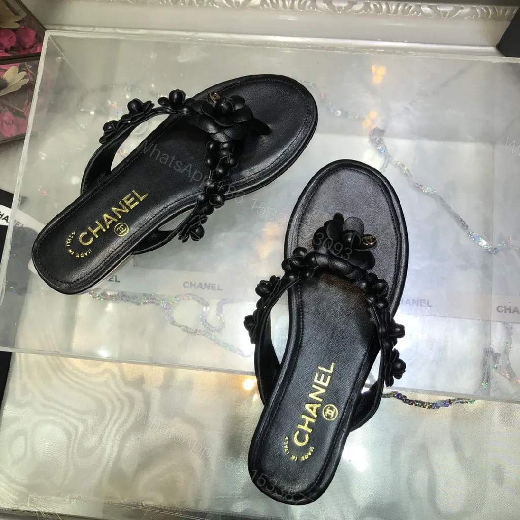 View 7 of Black Leather-Feel Floral Slip-Ons with Luxe Accents