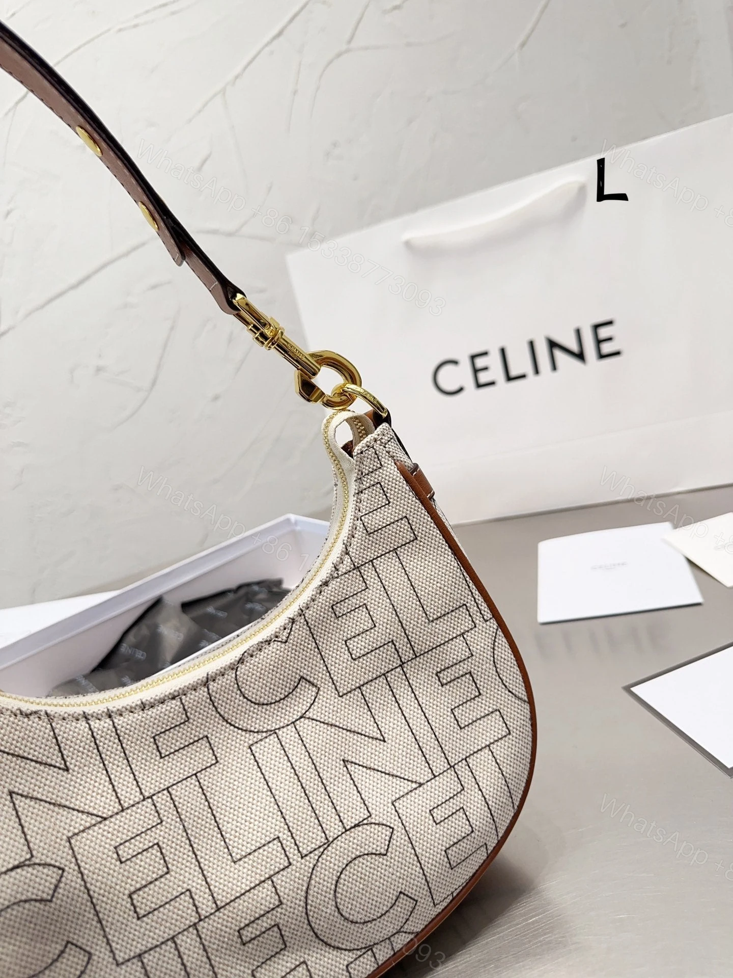 View 6 of CELINE MEDIUM AVA STRAP BAG IN TEXTILE WITH ALL OVER PRINT NATURAL 25CM 196922ERK02NT
