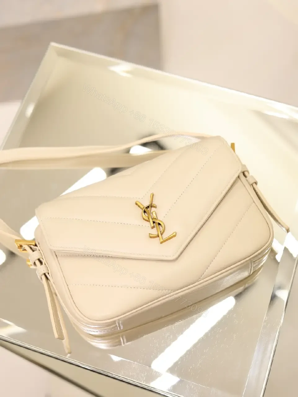View 5 of Off-White Cream Leather Mini Crossbody Bag with Chevron Front Feature