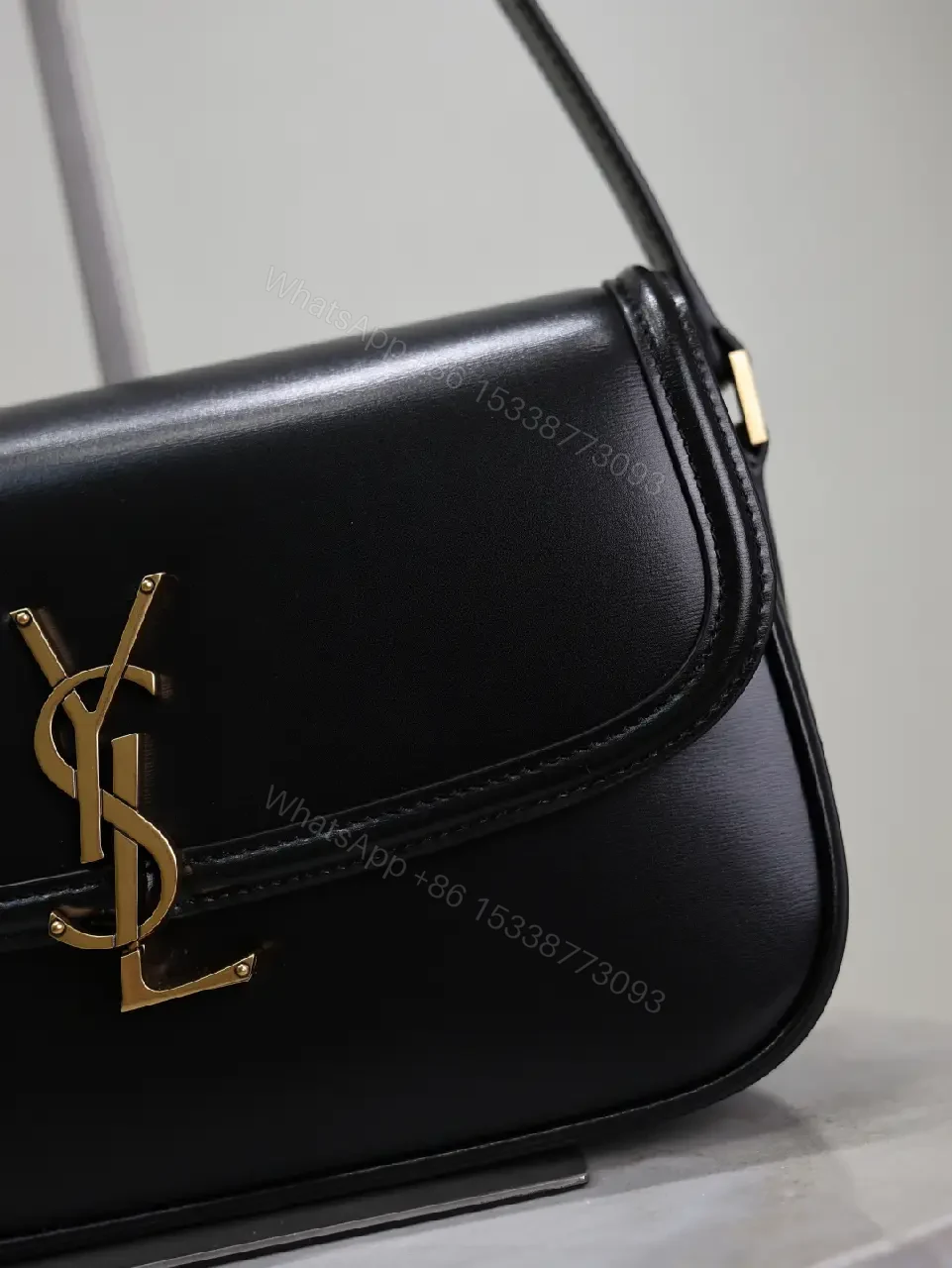 View 5 of Compact Black Leather Shoulder Bag with Gold Hardware